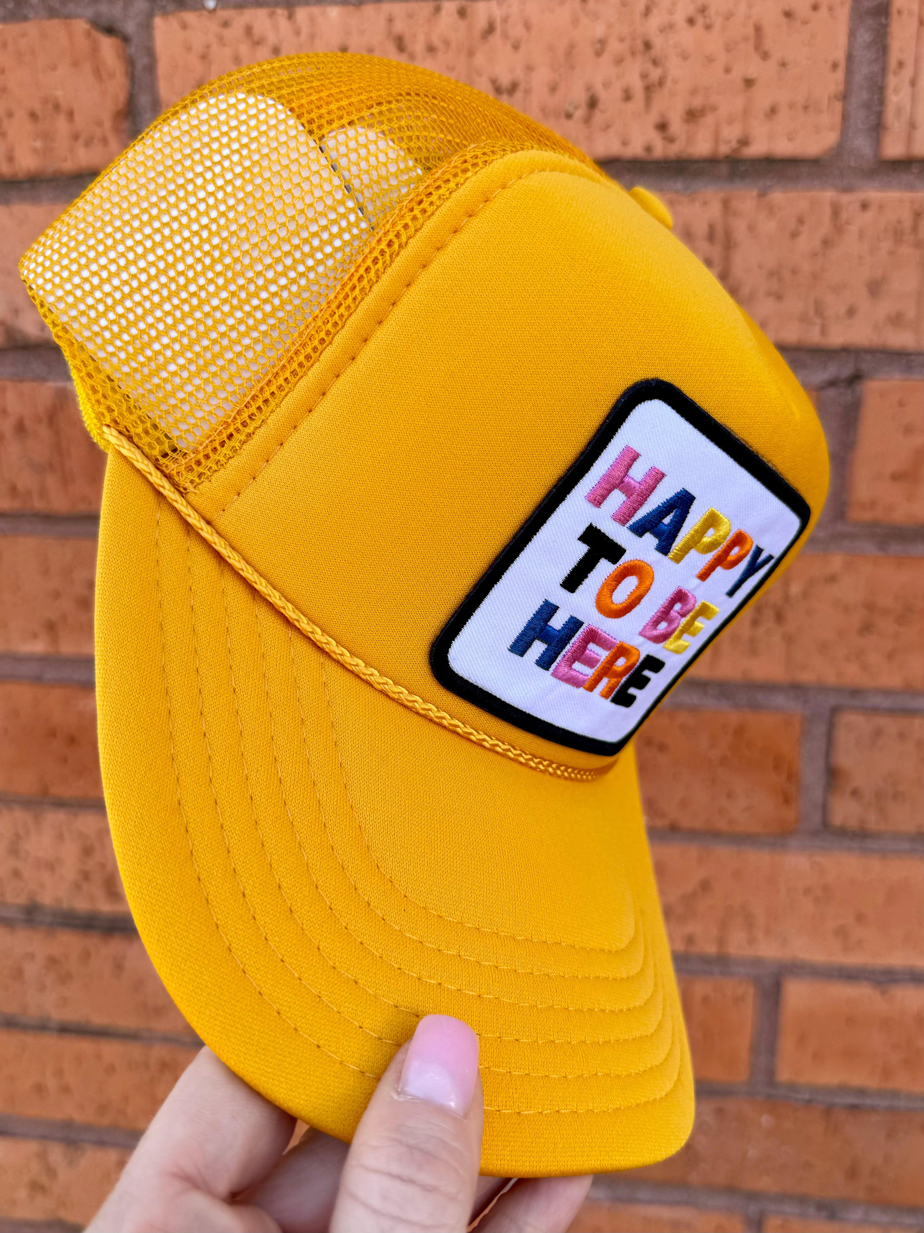 Happy To Be Here Trucker Hat In Yellow