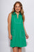 Green sleeveless mini dress with white contrast piping V-neck collar and front patch pockets, women's boutique dress at Gaudie & Co