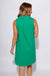 Green sleeveless mini dress with white contrast piping V-neck collar and front patch pockets, women's boutique dress at Gaudie & Co