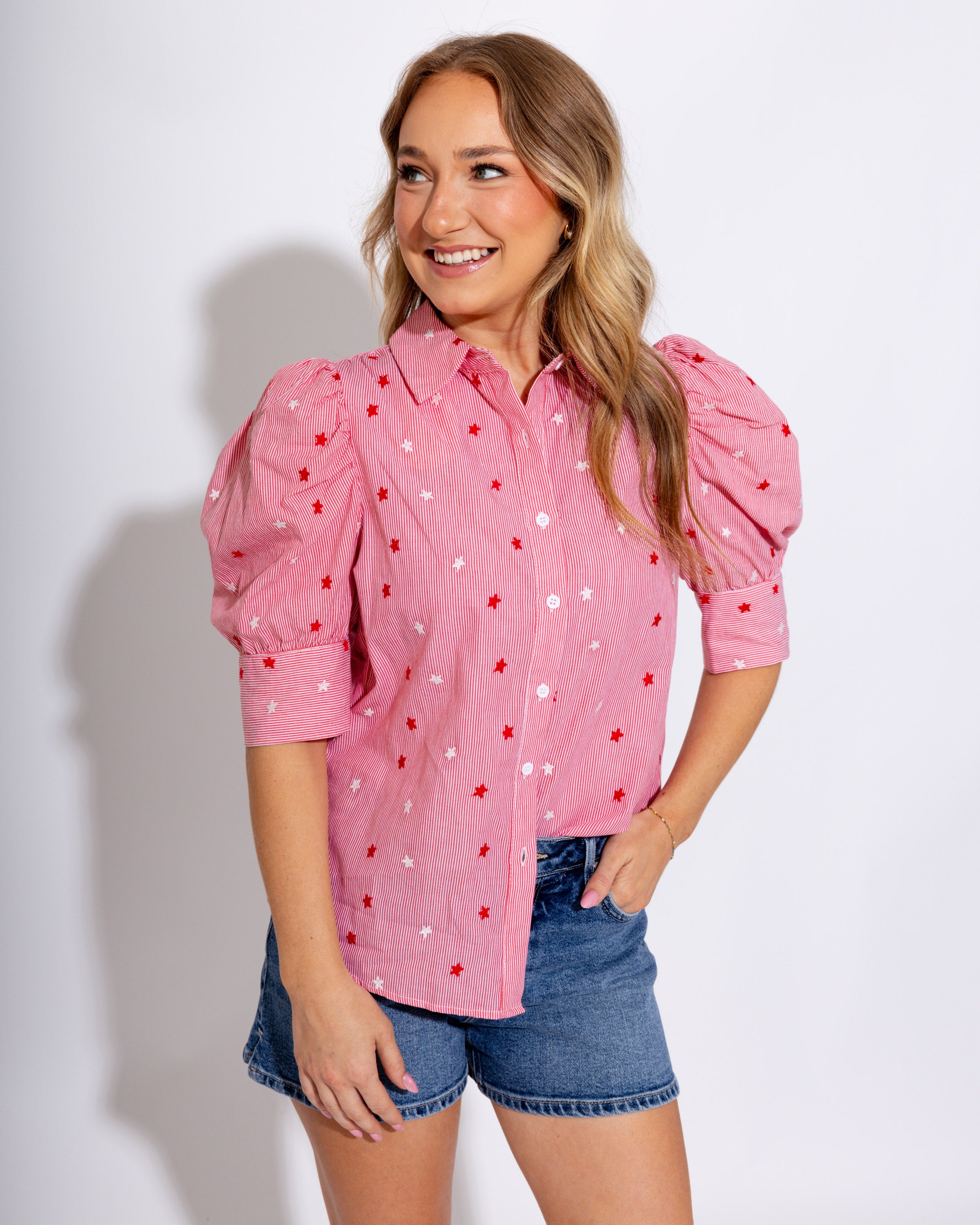Red striped puff sleeve button-up blouse with star embroidery and ruffle cuffs, women's boutique top at Gaudie & Co