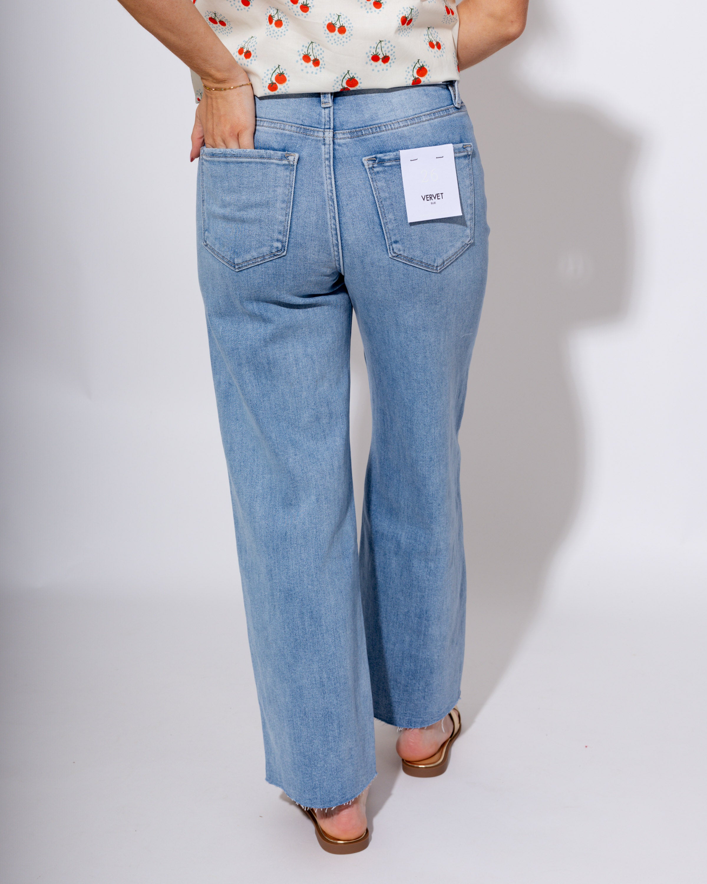 Vervet high rise light wash cropped wide leg jeans with raw hem, boutique denim at Gaudie & Co
