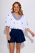 White puff sleeve top with blue and red sailboat embroidery, coastal nautical women's blouse at Gaudie & Co