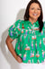 Novelty print puff sleeve button-front tiered top detail view, women's boutique fashion at Gaudie & Co
