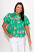 Green novelty illustrated print puff sleeve top with swans and animals, tiered yoke button-front boutique blouse at Gaudie & Co