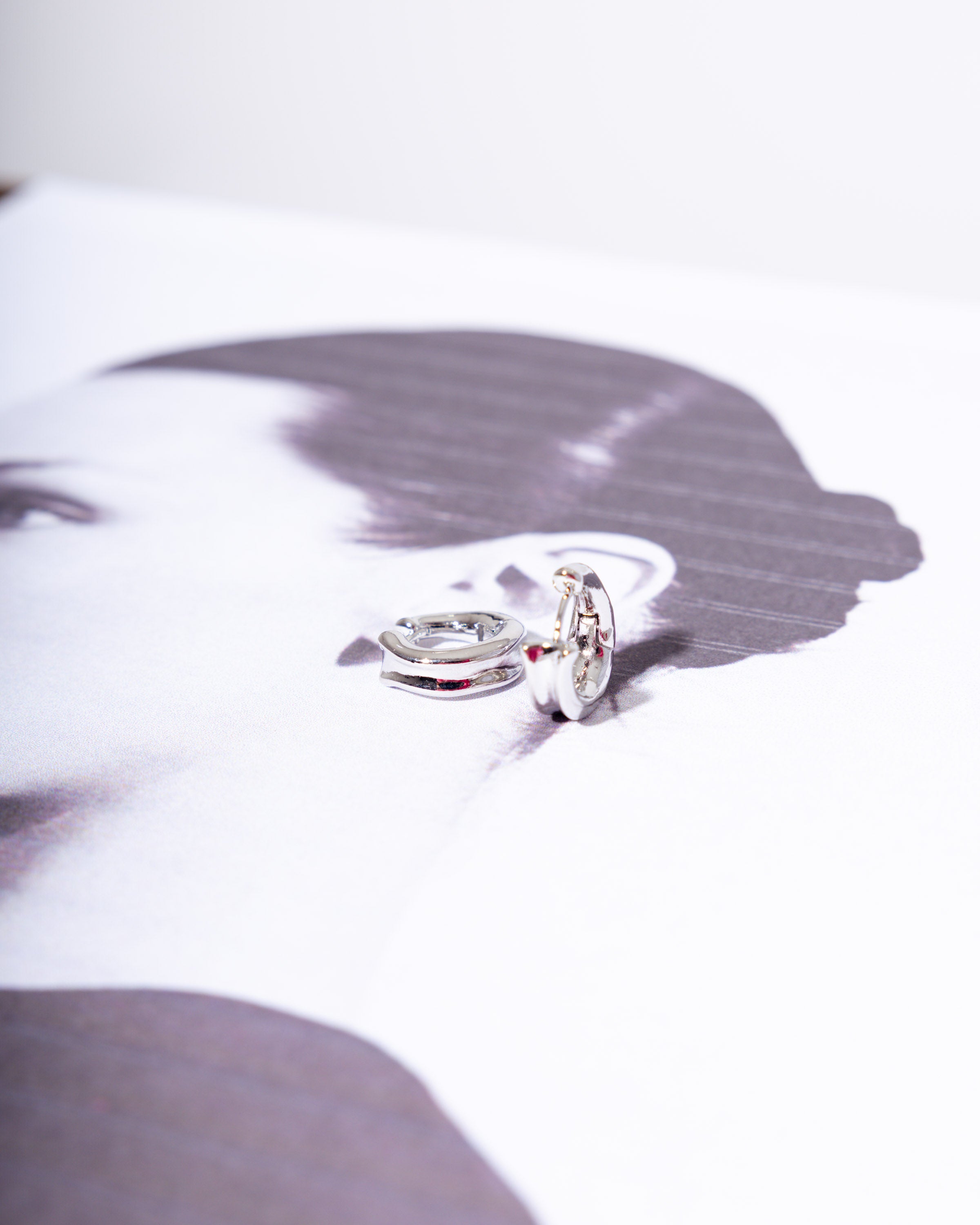 Gleam Huggie Hoops in Silver